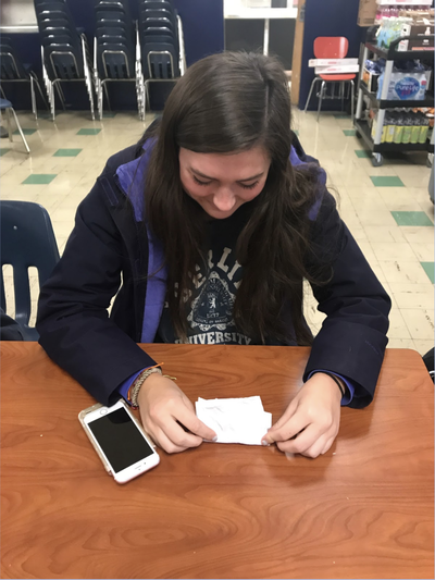 Find a new hobby: Use the new year as an excuse to find something new you like to do in your free time, like drawing. Hobbies can be great for stress relief, from cooking or fitness to art or music. This year, try something new and relaxing to do during your free time. Photo caption: Freshman Chloe Pappalardo takes up the art of origami during her free time at lunch.