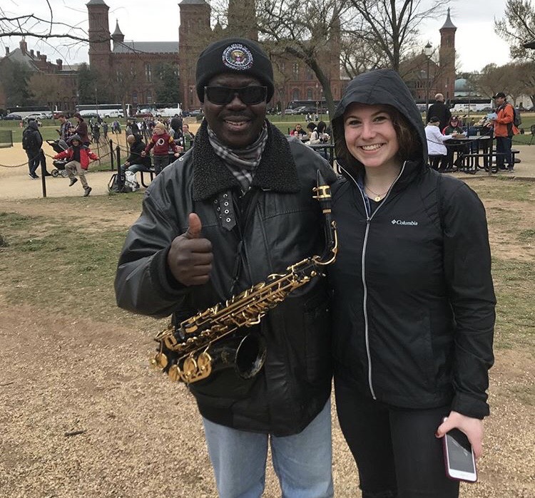 Musician Augustus Baraza with reporter Sarah Fox in the National Mall. 
