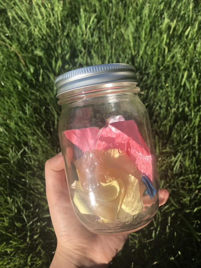 Origami placed in a Mason jar as a gift to a loved one.
