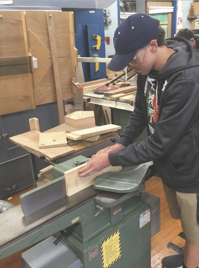 Junior Jack Ruckman works on a project in Woods ll