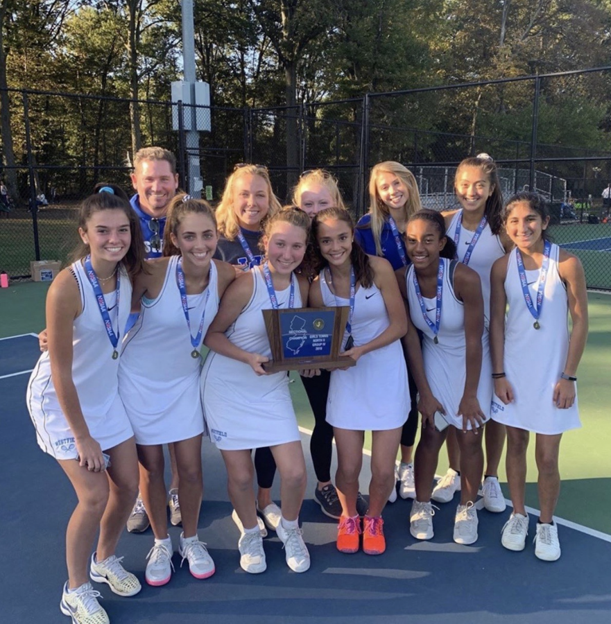 The WHS girls tennis team with the sectional championship trophy
