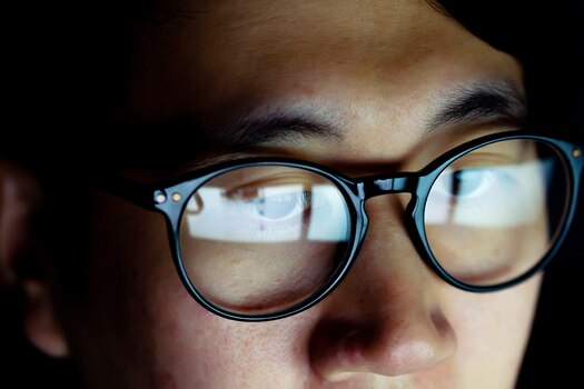 Man wearing blue light glasses