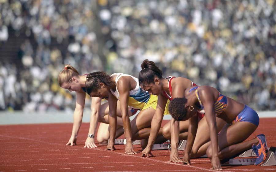 Female track athletes at the starting line