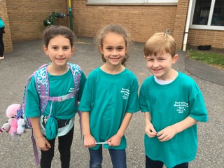 Washington students wearing last year's t-shirt contest winners 