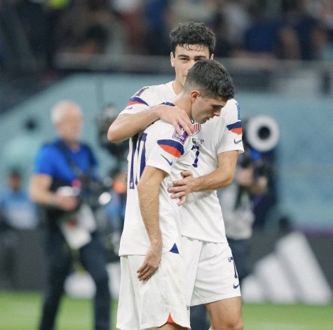 Gio Reyna comforts Christian Pulisic after the loss to Netherlands and the elimination from the World Cup on Dec. 3