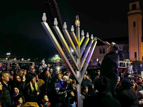 Rabbi Block from Union County Torah Center lighting the Menorah in downtown Westfield