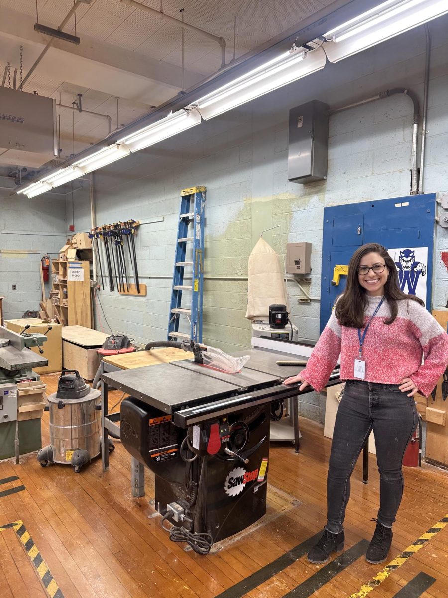 Industrial Arts Teacher Gina Reynolds in the woodshop with the table saw