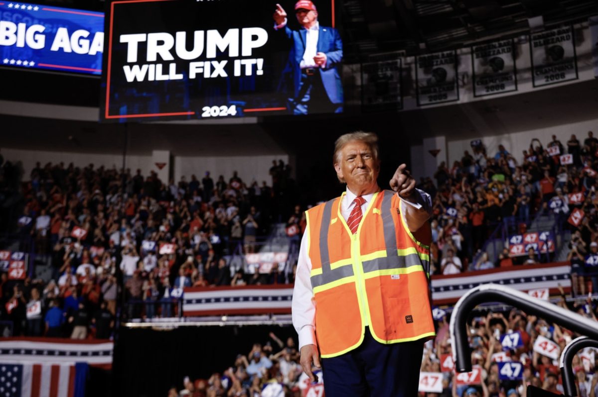 Magnifying his support for the working class, on Oct. 20 President-elect Donald Trump addressed supporters at a rally in Green Bay, Wisconsin wearing an orange vest after his appearance in a garbage truck