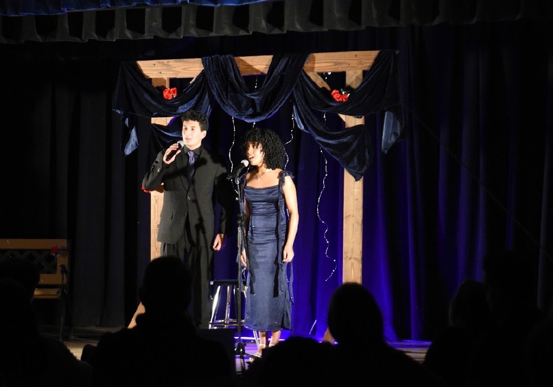 Kiran Patel (left) and Hana Forbes (right) singing at NOLS on Feb. 7

